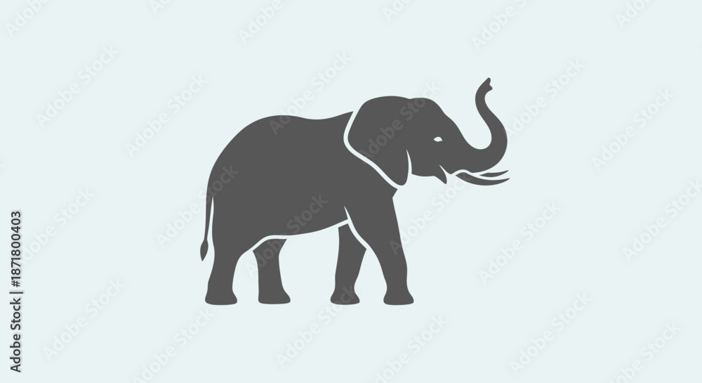 Fototapeta premium Gray elephant standing alone profile view.