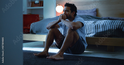 Photos Night, anxiety and man with depression, mental health and insomnia from sad thoughts in bedroom