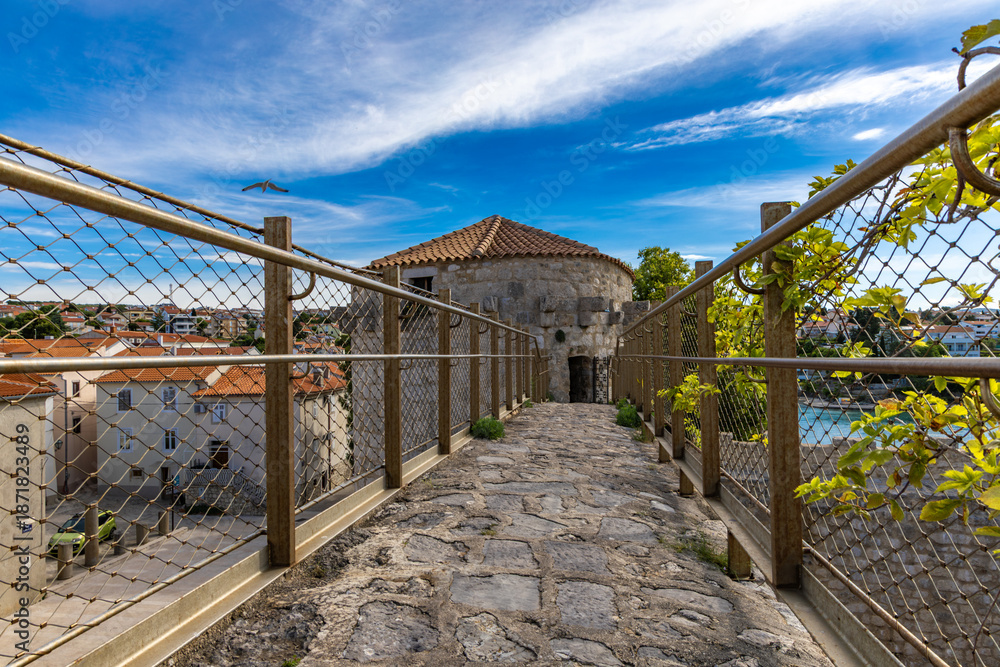 Fototapeta premium KRK, Croatia, May 28, 2025 - Frankopan Castle in Krk, ruins of the tower, courtyard with a square tower,