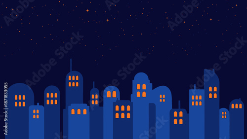City skyline at night with illuminated buildings against a dark blue sky.