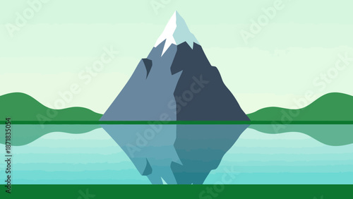 Serene mountain landscape with reflection in calm water.