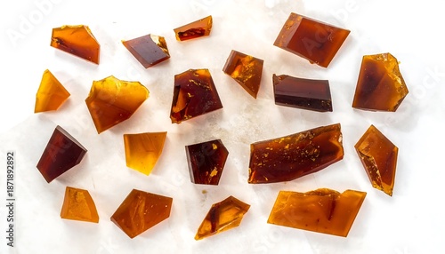 Collection of Amber Pieces on White Background, Close-Up.