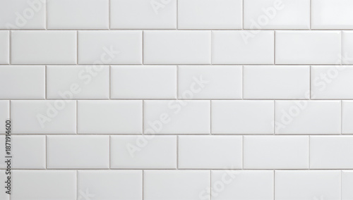 Clean white subway tiles arranged in a classic brick pattern for a seamless background
