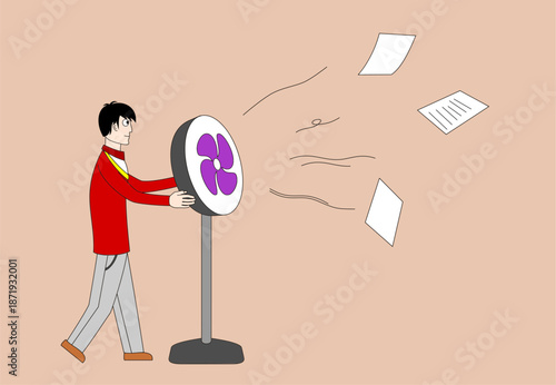 A man is holding a fan and blowing papers