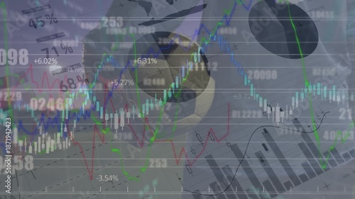Animation of graphs and financial data over legs of male soccer player with ball on field