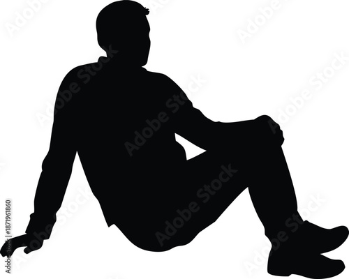 A silhouette of a man sitting casually with legs crossed and one hand