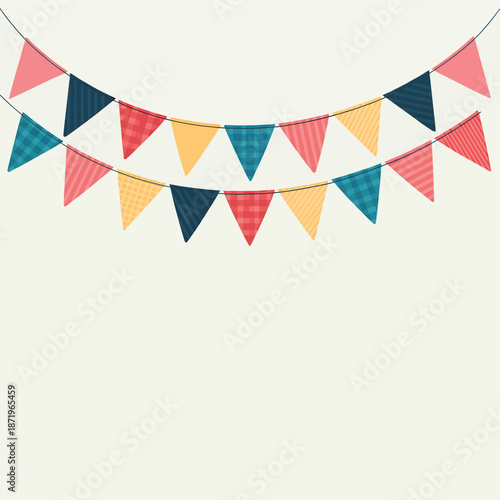 Colorful bunting flags hanging against a plain light beige background