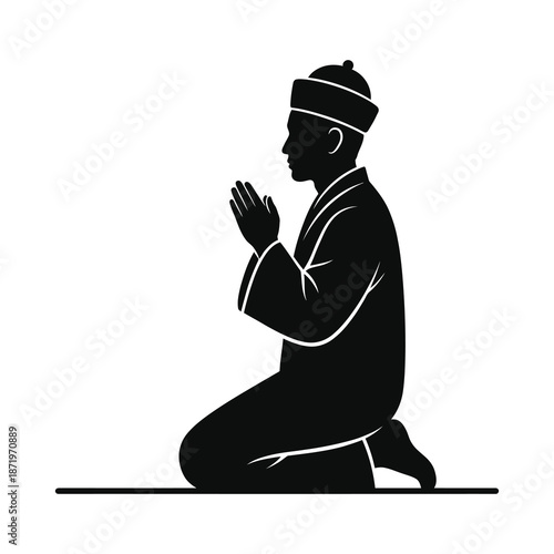 A silhouette of a man kneeling in prayer showcasing reverence and spiritual devotion in black
