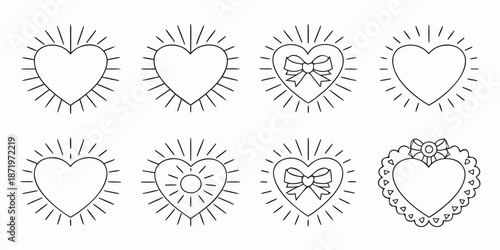 Collection of ornate heart designs with radiating lines and decorative elements