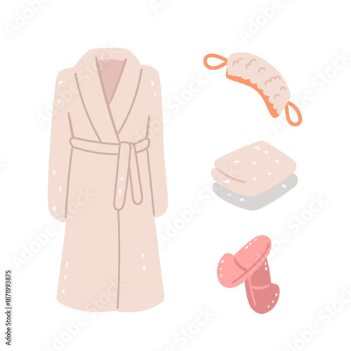 A complete spa kit featuring a soft bathrobe and massage accessories. The ultimate set for a day of rest and self care.