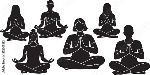 Group of people meditating in yoga poses together