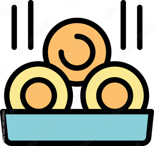 Freshly cooked falafel balls dropping into a tray, ready to be served in a pita or enjoyed as a snack