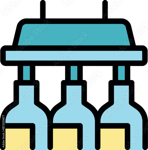 Wine bottling machine filling wine bottles on an assembly line in a modern winery