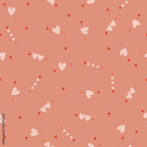 Seamless pattern with many hearts different sizeson peach background. Vector illustration for wrapping paper, card, Valentine's Day.