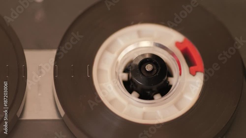 Macro close-up vintage audio cassette spinning in old tape player retro analog music nostalgia 80s 90s