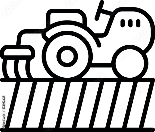 Tractor plowing a cultivated field, agricultural machinery working the land