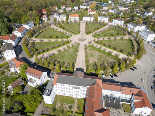 Bilde på lerret High angle aerial view of Circus Putbus, a unique circular town square with a central obelisk and radiating paths surrounded by white neoclassical buildings