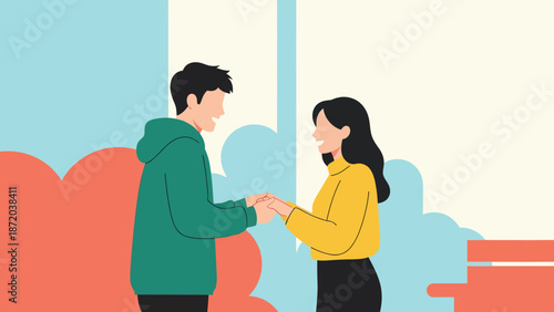 Young couple holding hands talking in autumn park