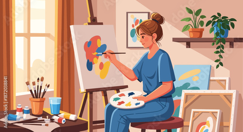 A woman artist creates an abstract painting in her well lit cozy home art studio