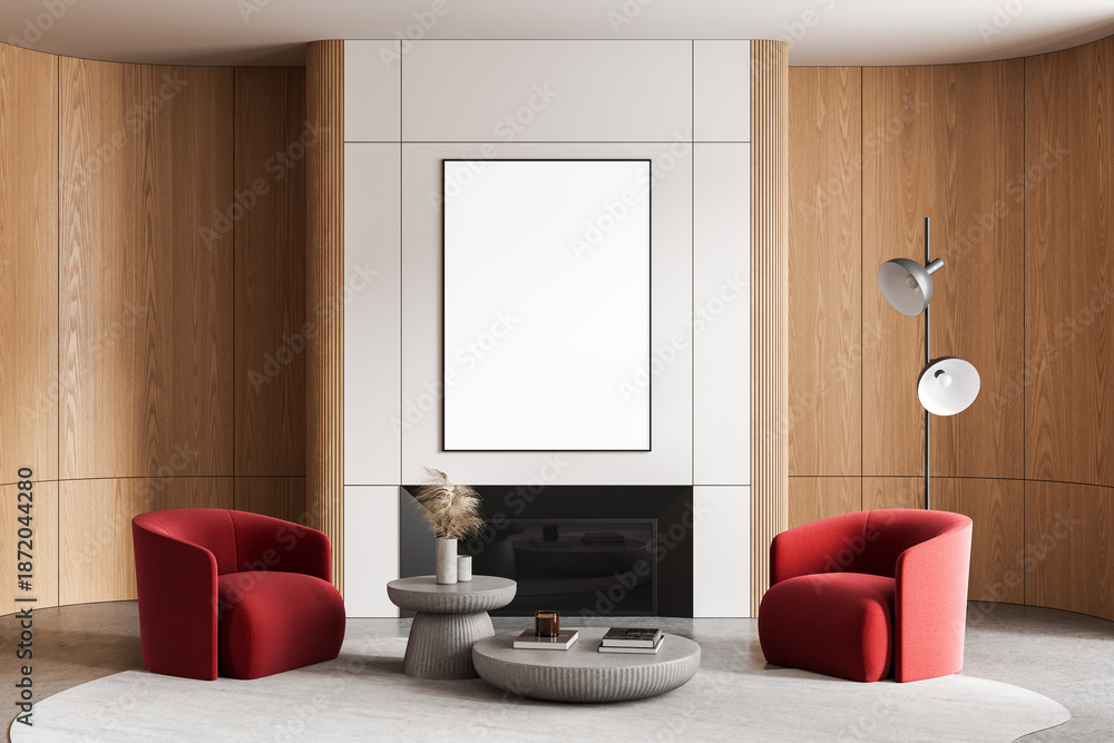 Naklejka premium Modern interior with blank framed poster mockup above fireplace, red armchairs, and minimalist furniture in clean wood and white wall design. 3D Rendering