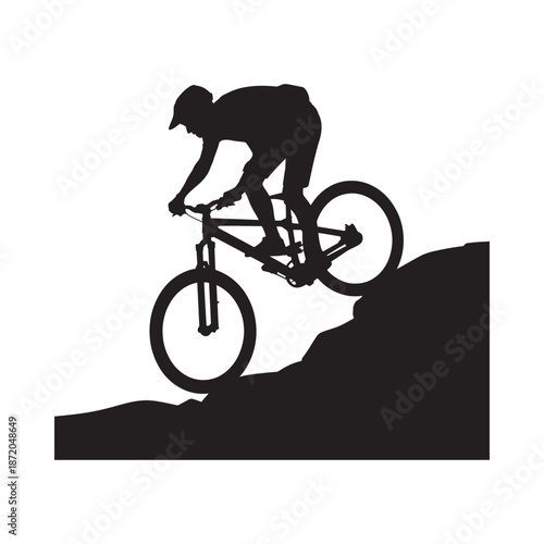 Silhouette of a mountain biker riding uphill showcasing a dynamic and adventurous outdoor scene