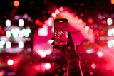 Smartphone Recording Live Concert With Colorful Stage Lights