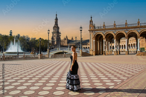 the Andalusian girl with a flamenco dress in one of the most beautiful squares of Seville in Andalusia