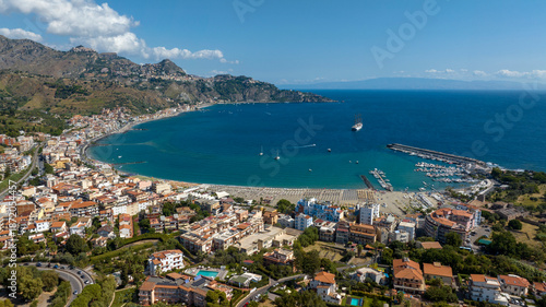 Aerial view of Giardini Naxos, a town in the province of Messina, Sicily, Italy. It is situated on the coast of the Ionian Sea. It is a popular tourist destination and a cruise ship stop.