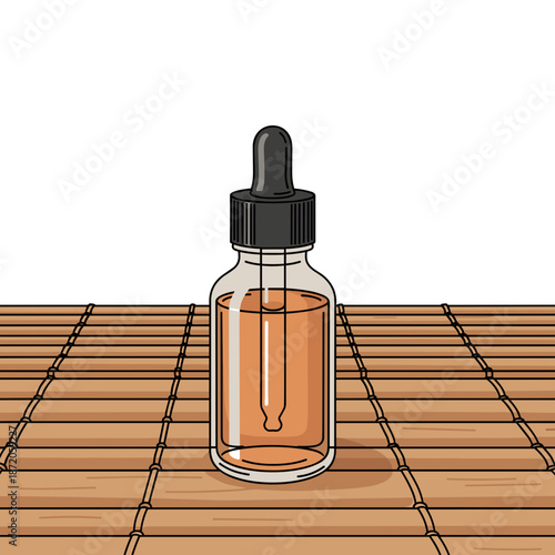 Massage oil in dark glass bottle with dropper on bamboo mat