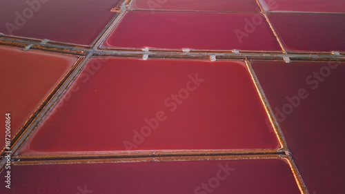 Aerial view of the Margherita di Savoia salt mines at sunset in Puglia, Italy