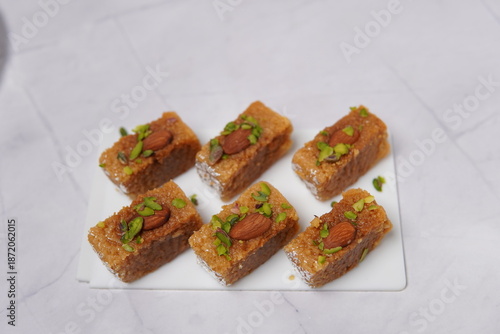 Photography Milk Cake is a classic Indian sweet prepared by slowly reducing milk to form rich, caramelized milk solids, then sweetened and set into soft blocks