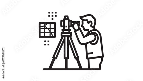 A photographer adjusts the camera on a tripod to capture a precise image