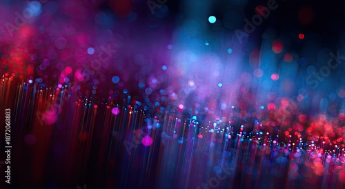 Abstract light strings fade from red/purple to blue with bokeh