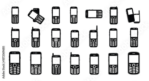 An assortment of vintage cellular phones displayed in a neat black and white arrangement