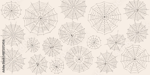 An array of detailed spiderwebs presented on a light beige background