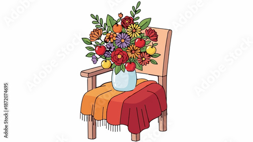 A colorful floral arrangement with apples sits in a vase on a chair draped with a warm blanket