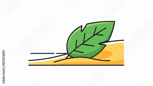 A green leaf rests on a sandy surface with lines suggesting motion