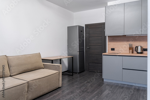 Картината върху платно studio apartment design in modern minimalist style with built-in furniture and household appliances