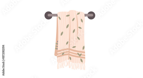 Decorative hand towel with leaf pattern hanging on a simple wall-mounted towel rack for bathroom or kitchen interior design projects.