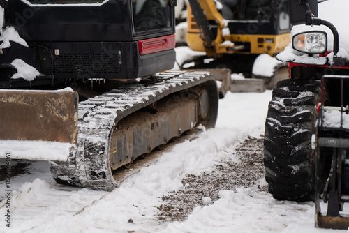 Vászonkép Construction equipment details showing excavator steel tracks and compact vehicl