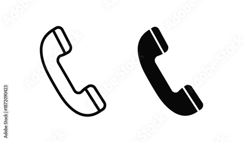 Two black and white phone handset icons on a pure for communication or business concepts