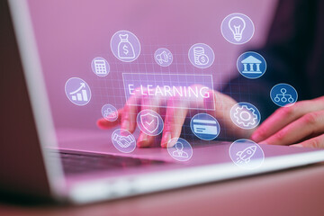 Fingers tapping on laptop keyboard with e-learning icons floating on screen in a modern workspace setting