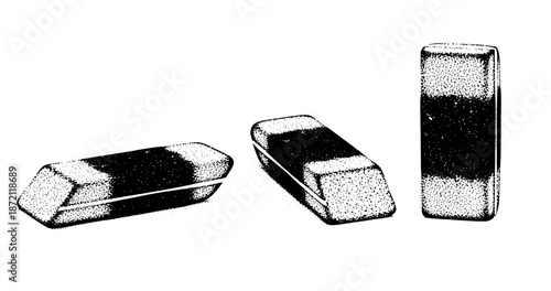 Three black and white rectangle erasers in different angles