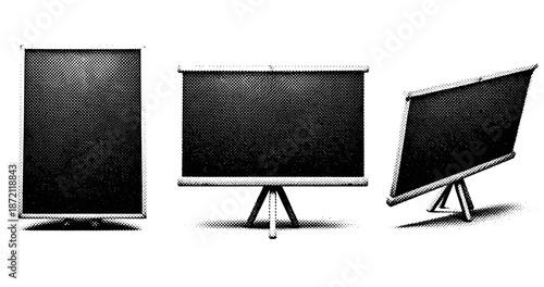 Three vintage projection screens on tripods in black and white