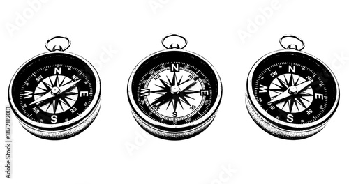 Set of three vintage compasses in black and white