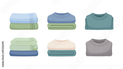 Collection of neatly folded sweaters and blankets in various shades of blue and green, depicting organized textiles.