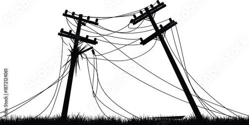 Silhouette of damaged utility poles and tangled power lines leaning after a storm or natural disaster over a grassy field.