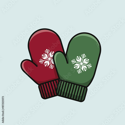 Pair of festive winter mittens with snowflake design.