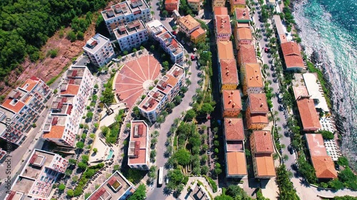 Wallpaper Mural Phu Quoc, Sunset Town, Vietnam. 4k high-quality footage taken with a Drone showcasing colorful buildings, blue skies, a watch tower, a kissing bridge, turquoise clear waters, green forest, golden sand Torontodigital.ca