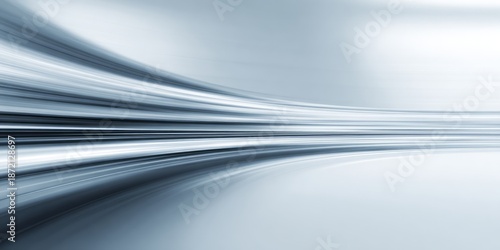 Abstract light streaks flow with motion blur creating a sense of speed.